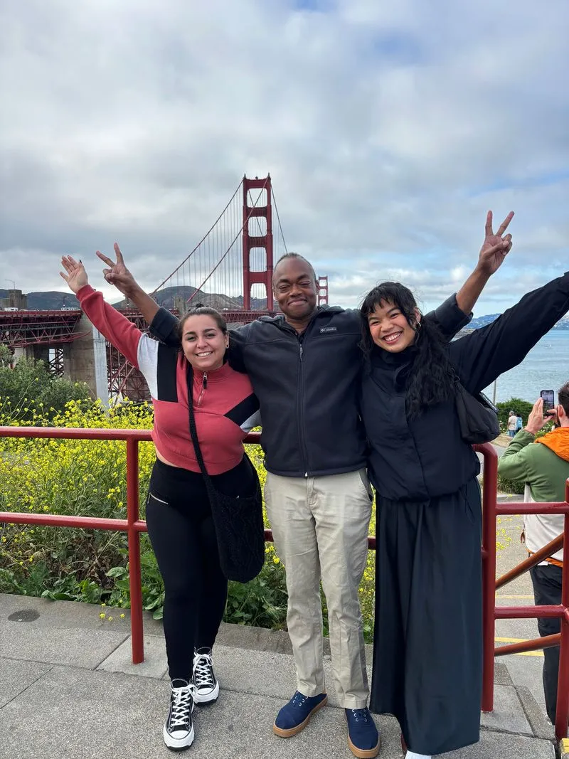 Three Theralytics team members standing in front of the Golden Gate Bridge